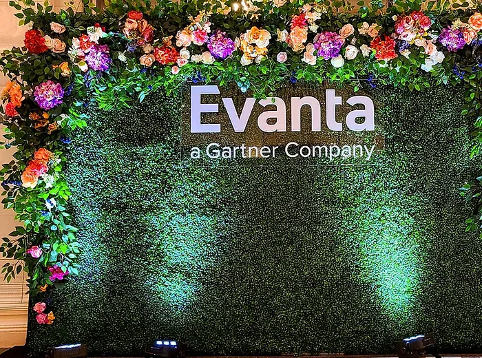 Flower wall backdrop at a corporate event