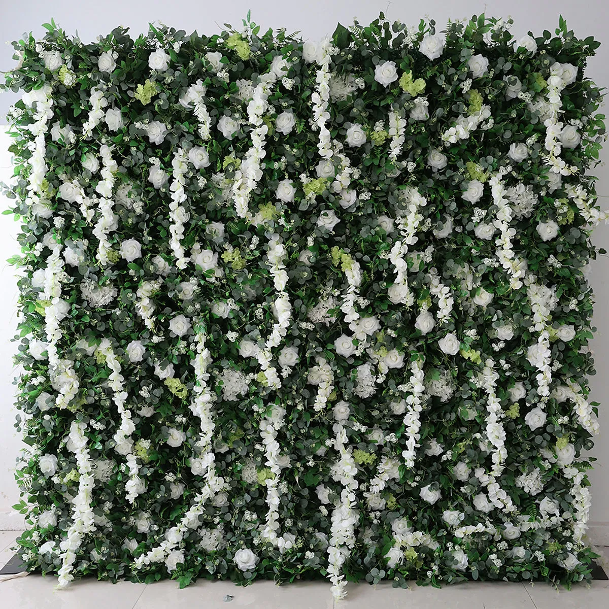 Tailed Jay flower wall rental — white and green floral backdrop